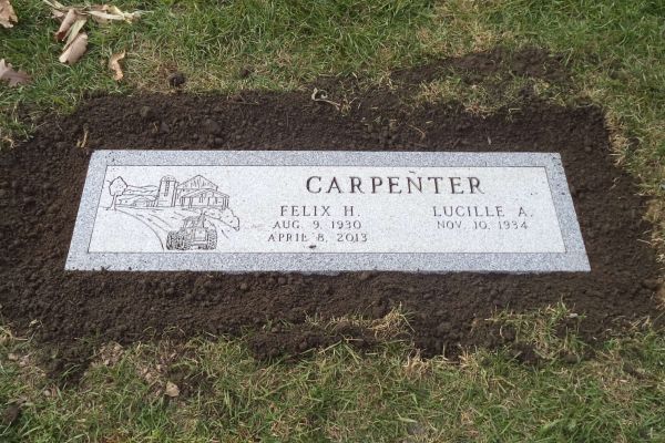 Flat grave marker made from granite.