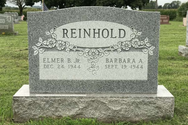 Granite upright headstone.