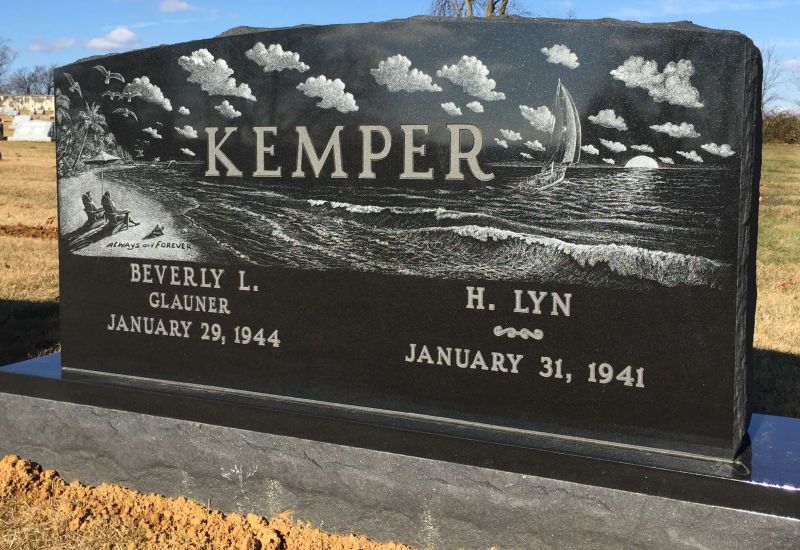 Upright granite headstone with custom engraving.