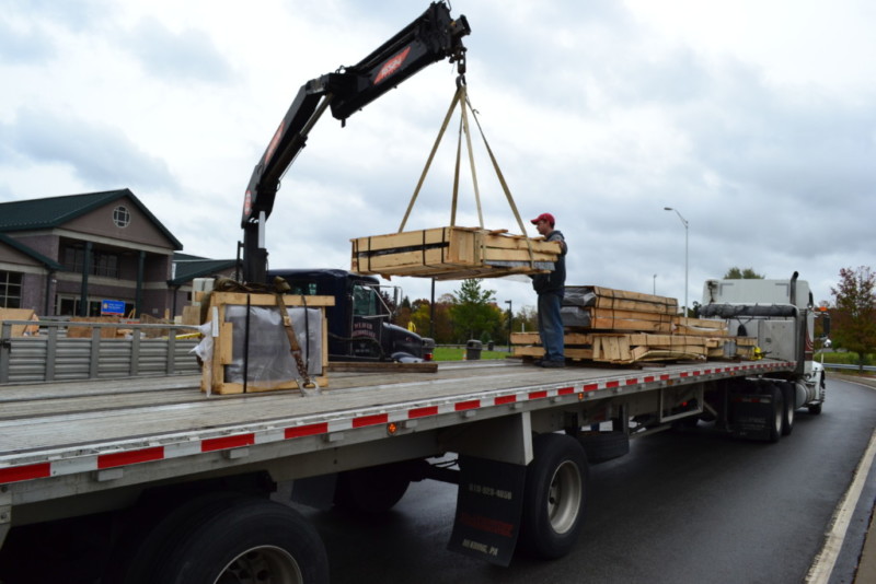 Component pieces of the Pennsylvania State Police Memorial being unloaded for installation.