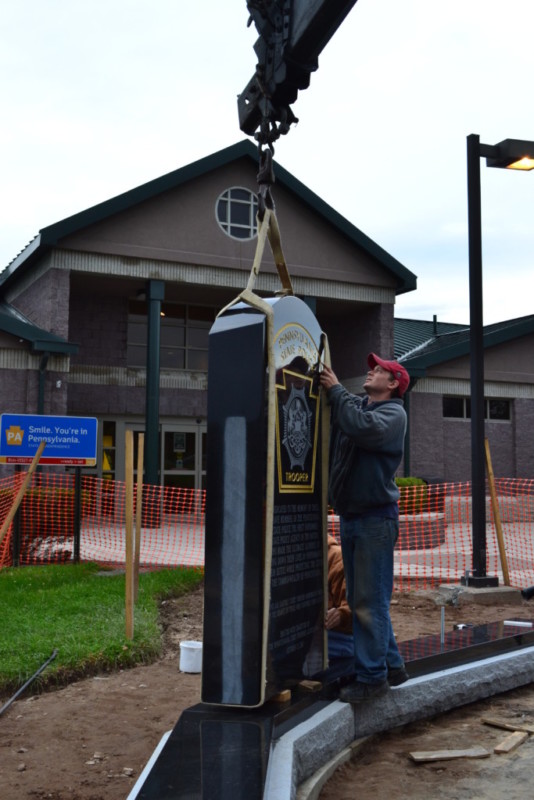 Pennsylvania State Police Memorial centerpiece being lowered into place.