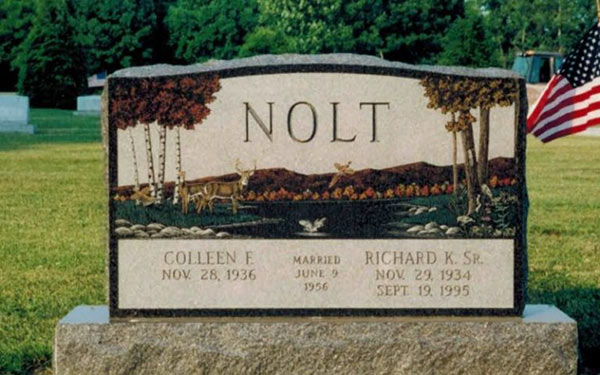 An ornately engraved grave stone.