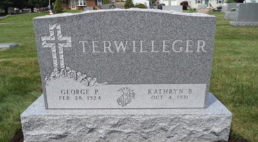 Custom engraved memorial granite headstone.